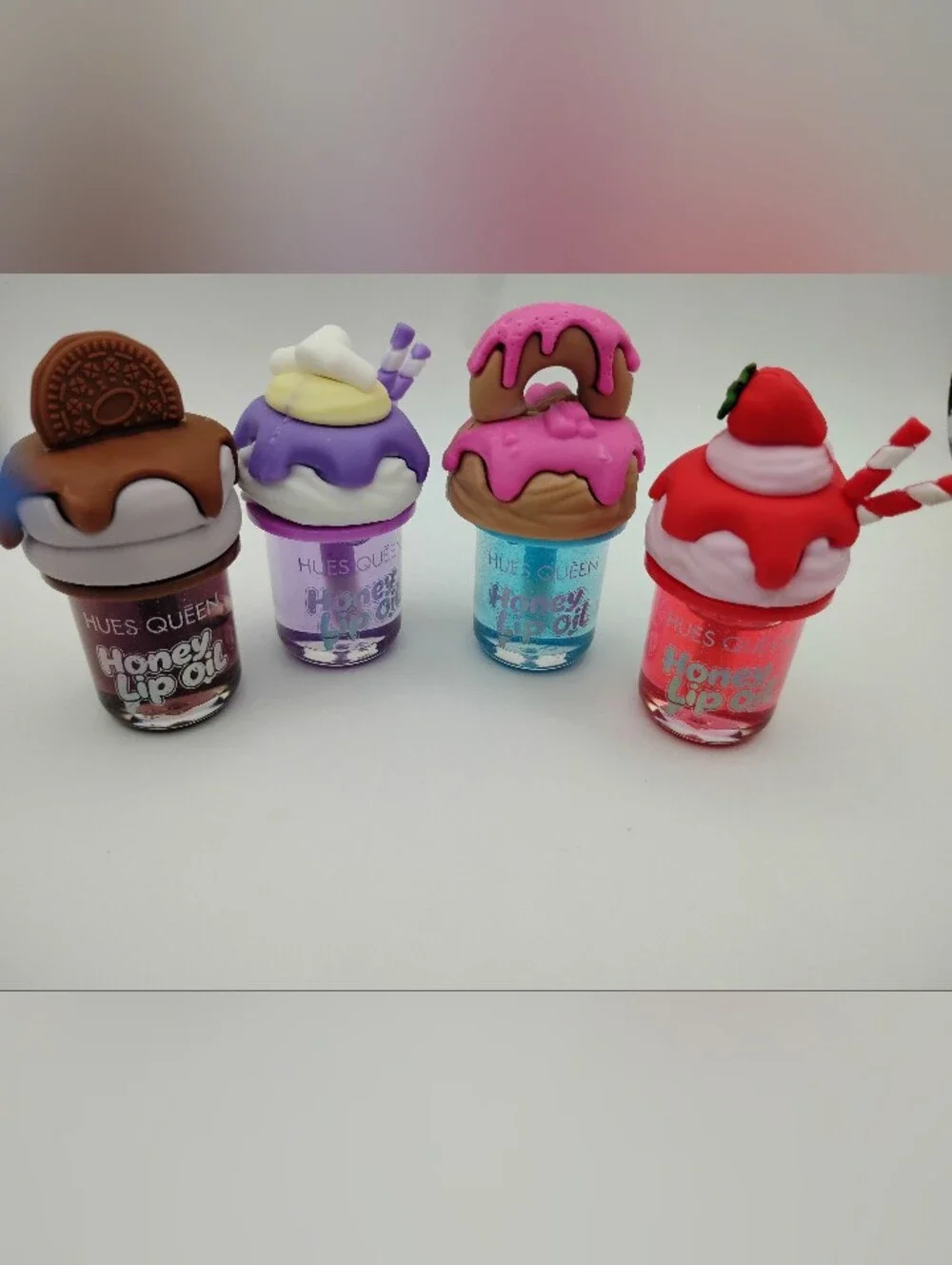 Honey Lip Oil With A Cookie, Donut, Strawberry, & Milkshake Top